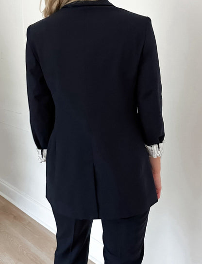 Back view of women's navy blazer #color_Navy